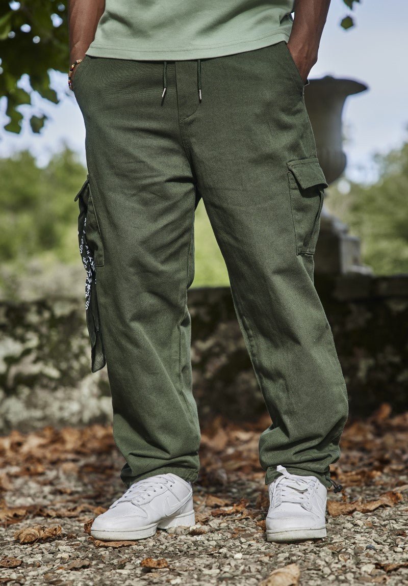 Wijde effen joggingbroek met grote zakken aan de zijkanten van de knieën - Afbeelding 4